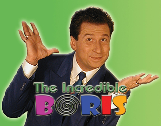Promotional image of a man in a blue suit with hands up, text reads “The Incredible BORIS” in colorful letters against a green gradient background.